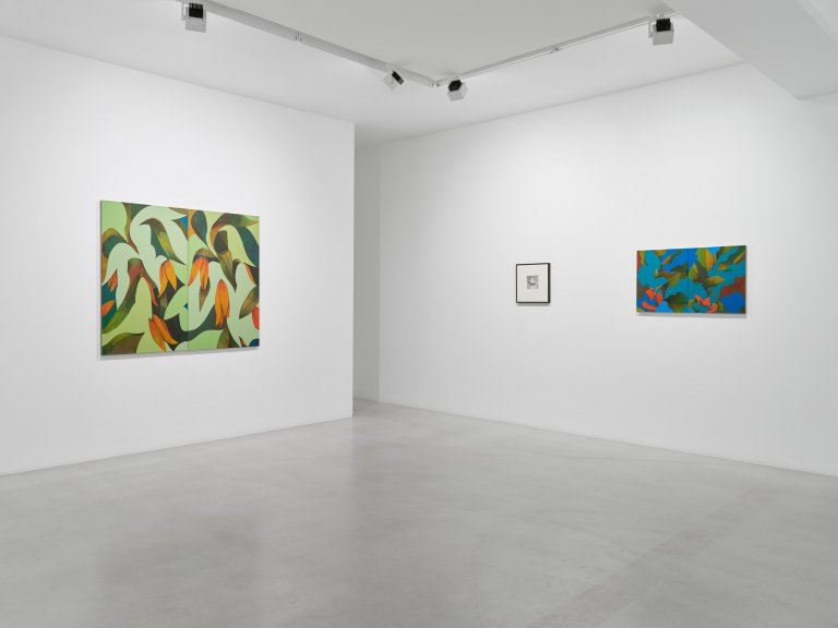 Exhibition view featuring artworks by Ryan Mrozowski. The image showcases a series of paintings with vibrant, repeated patterns and botanical motifs, arranged in a carefully curated space.