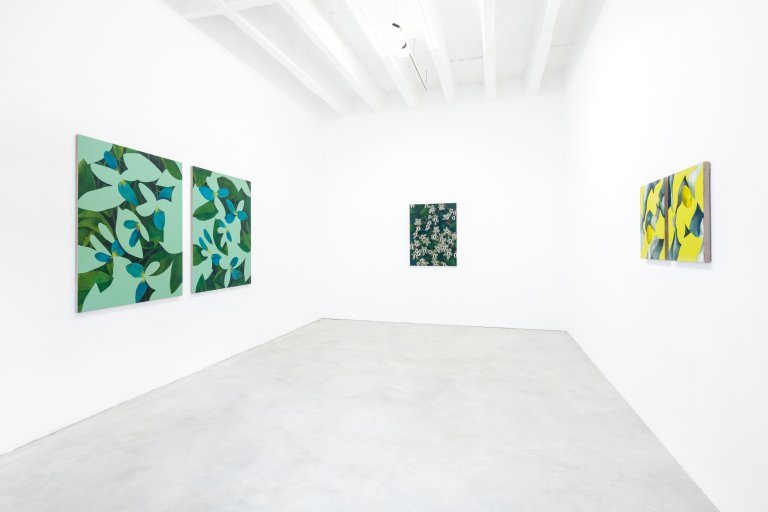 Exhibition view featuring artworks by Ryan Mrozowski. The image showcases a series of paintings with vibrant, repeated patterns and botanical motifs, arranged in a carefully curated space.