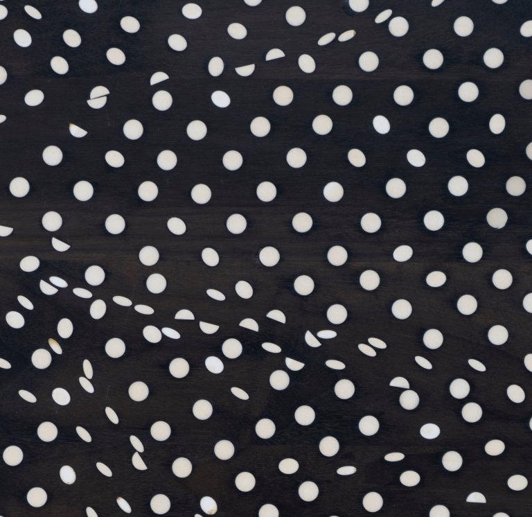 Artwork by Ryan Mrozowski featuring an arrangement of dots. The composition explores repetition and variation, creating a dynamic interplay between pattern and perception